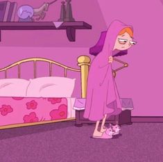 a woman in a pink robe standing next to a bed with a cat on it