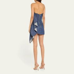 LaQuan Smith strapless denim mini dress features a ruched ruffle detailing at the side  Sleeveless Hem falls above the knee Bodycon silhouette  Back zip closure  Cotton Made in USA Laquan Smith, Denim Mini Dress, Denim Mini, Above The Knee, The Knee, Made In Usa, Tops Designs, Mini Dress, Luxury Fashion