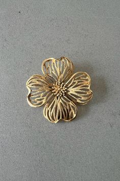 Trifari brooch gold plated flower brooch Vintage Crown Trifari Signed Brooch gift vintage jewelry gift for her vintage gift Trifari jewelry Antique brushed gold metal flower brooch signed as Trifari. This jewel is pre-owned and in great condition, with very minimal signs of wear. Please refer to all the pictures for more details, and feel free to message me if you need more information, this is a pre-owned jewel and I might not have more details on metals, gemstones, etc.  NOTES: *   All vintage Gold Flower Lapel Pin For Formal Occasions, Collectible Gold Filigree Brooches, Gold Filigree Brooches Collectible, Gold Filigree Brooches For Collectors, Gold Flower Brooch Lapel Pin, Gold Flower Pendant Brooch Jewelry, Gold Flower Brooch For Formal Occasions, Elegant Gold Flower Lapel Pin, Victorian Gold Brooches For Gifts