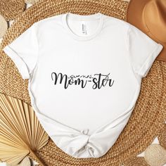 Embrace the delightful chaos of motherhood with our Mom-ster T-Shirt! This fun and whimsical tee features the word "mom-ster" in a bold and eye-catching font, celebrating the occasional mayhem and endless love that comes with being a mom. Made from soft and comfortable fabric, it's perfect for keeping you stylish and relaxed during those busy mom days. Whether you're tackling the daily tasks of parenting, running errands, or just enjoying some well-deserved downtime, this tee is sure to bring a Motherhood Humor, Motherhood Funny, Mama Shirts, Daily Tasks, Mom Day, Endless Love, Mama Shirt, T Shirt Funny, Busy Mom