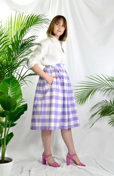 Lilac and white check high waist full gathered skirt. Perfect for casual outfits and special ocasions with pair of trainters or high heels. 100% cotton.  Elastic at the back of waist.  Two side pockets. Midi lenght about 70cm + 5 cm waistband. Handmade in UK.  Model wears size S.  HOW TO CHOOSE A SIZE ?   Using a measuring tape, measure the smallest part of your waist.  SIZE CHART: (CM) XS - W: 66 CM S - W: 70 CM M - W: 74 CM  L - W: 78 CM  XL - W: 82 CM  CARE INSTRUCTIONS: Hand wash only, do no Cheap Gingham Skirt For Spring, Polka Dots Skirt, Classic Casual Style, Fluffy Jacket, Gingham Skirt, Classic Casual, Style Skirt, Linen Skirt, Gathered Skirt