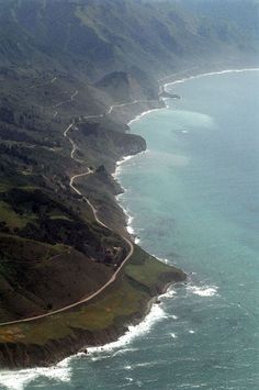 an aerial view of the ocean and coastline