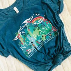 a blue t - shirt with the words hawaii on it and palm trees in front