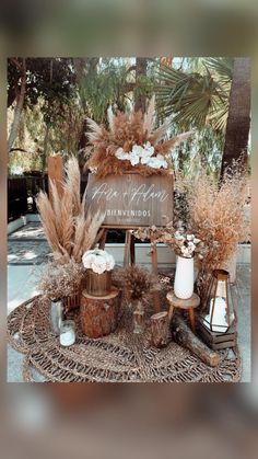 there is a wooden sign with flowers and plants on it in front of some trees