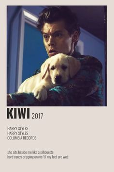 a man holding a dog in his arms with the caption kwi harry styles harry styles columbia records