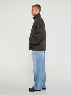 This Stone Island jacket features a padded design and a signature detachable Compass badge. With a concealed hood, funnel neck, press-stud and zip fastening, long sleeves, and four front flap pockets. Complete with quilted lining. Stone Island Jacket, Socks Sneakers, Sneaker Jewelry, Shoe Boot Sandals, Classic Shoes, Scarf Jewelry, Stone Island, Pant Shirt, Shirt Skirt