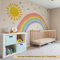 a baby's room with a rainbow wall mural