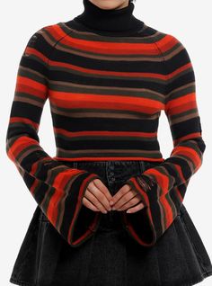 Who else is ready for temps to dip? This cropped turtleneck sweater will have you feeling like fall  thanks to its orange  brown  black and dark green stripes  bell sleeves and faux distressing. 100% acrylicWash cold; dry flatLength: 16 12"ImportedListed in junior sizesModel is 5'8"Model wears size Small Cropped Turtleneck Sweater, Girls Turtleneck, Cropped Turtleneck, Emily The Strange, Hot Sweater, Orange Outfit, Halloween Sweater, Orange Sweaters, Striped Turtleneck