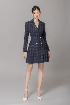 Crafted with high-quality tweed, this dress showcases a timeless A-line silhouette and a double-breasted front for a sophisticated touch. Perfect for any occasion, this dress exudes elegance and exclusivity.