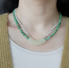 This handmade antique style mint jade Huang (璜) necklace is for a mysterious Asian touch. In the Divine Land, Jade is respected as the emperor of all gemstones. It represents eleven virtues, including a noble character, grace, loyalty, intelligence, and sincerity.⚜ Specifics❀ Mint Jadeite 2-4mm & Faceted Moonstone 2-3mm ❀ Green Jadeite 6mm & Fresh Water Pearl 2mm❀ Mint Jade Huang 0.5" x 1.75" (12m x 45m) ❀ Length 16 in. 16 Inch Necklace, White Jade, Jade Necklace, Jade Green, Double Layer, Antique Style, Moonstone, Jade, Freshwater Pearls