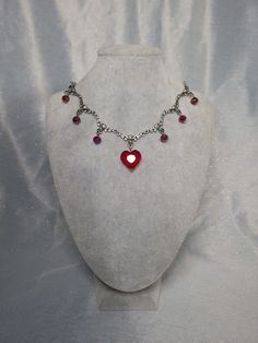 Beautiful red and silver. Dazzle everyone you see Queen Of Hearts Necklace, Victorian Gothic Jewelry Red, Red Gothic Jewelry With Heart Charm, Red Gothic Metal Necklace, Red Gothic Heart Pendant Jewelry, Gothic Choker, Gothic Chokers, Replica Jewelry, Necklace Gothic