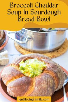 Broccoli cheddar soup on a brown plate with soup pot in the background.