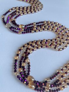 Double Strand Waist Bead, a stunning blend of purple crystal glass beads with elegant gold and brown accents. Why You'll Love It: Exquisite Sparkle: Beautiful purple crystal glass beads create a radiant, eye-catching shimmer. Elegant Accents: Gold and brown crystal glass beads add a touch of luxury and sophistication. Perfect Fit: The adjustable double strand design ensures comfort and a secure fit for all body types. Cultural Beauty: This piece reflects the rich heritage of Ivorian craftsmanshi Cultural Beauty, Wearing Purple, Strong Hand, Purple Crystal, Ivory Coast, Purple Crystals, Gold Accents, Crystal Glass, Design Crafts