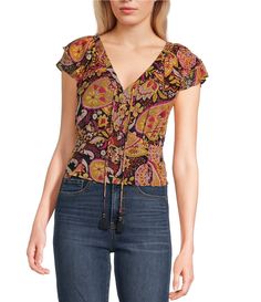 From Jessica Simpson&#x2C; this blouse features:Floral printV-necklineShort flutter sleevesPullover stylingSquare hemPolyesterMachine wash/tumble dryImported. Viscose Tops With Floral Print And Short Sleeves, Bohemian Short Sleeve Viscose Blouse, Spring Patterned Viscose Tops, Patterned Viscose Tops For Spring, Fitted Casual Peasant Top With Short Sleeves, Multicolor Rayon Tops For Fall, Chic Patterned Short Sleeve Blouse, Fall Printed Short Sleeve Blouse, Fall Season Printed Short Sleeve Blouse