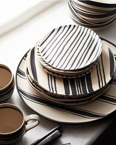 black and white striped plates with coffee cups