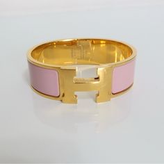 Pre-Owned Hermes Bangle. It Comes With Original Box, Dust Bag And Card. Made In France. In Great Condition. Please Check The Photos For More Details. Gold-tone Hardware Bracelets As Gift, Elegant Tan Bracelet For Gift, Modern Bracelets With Gold-tone Hardware, Designer Pink Bracelets For Formal Occasions, Hermes Bangle, Hermes Jewelry, Womens Jewelry Bracelets, Original Box, Dust Bag