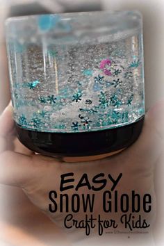 someone is holding an empty snow globe in their hand with the words easy snow globe craft for kids