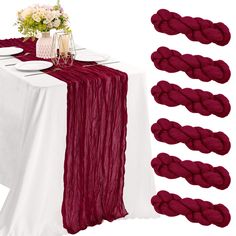 the table is set with red yarn and place settings