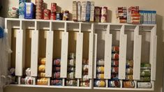 the shelves are filled with canned food items