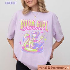 Embrace your love for reading and the summer with our "Book Girl Summer Comfort Colors Shirt"! This trendy, oversized tee is perfect for the ultimate summer-loving bookworm. Featuring a fun and whimsical design that blends your passion for books with summer vibes, this shirt is ideal for vacation trips and lazy poolside days. A perfect gift for any bookish friend or romance novel enthusiast, this tee combines comfort and style with a hint of humor. Enjoy your summer adventures with a book in one Summer Graphic Print Bookish T-shirt, Summer Bookish T-shirt With Letter Print, Spring Bookish Short Sleeve T-shirt, Spring Bookish Style Short Sleeve T-shirt, Bookish Short Sleeve T-shirt For Spring, Cute Summer Graphic T-shirt, Cute Summer T-shirt With Graphic Design, Summer Bookish Tops With Letter Print, Spring Bookish T-shirt With Letter Print