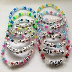 six bracelets with names and hearts on them