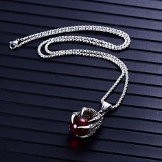 This Dragon's Gem necklace depicts a dragon claw grasping a priceless gem from its hoard. Made with stainless steel, this striking necklace is great gift for loved ones who also enjoy dragons and fantasy.Materials: Stainless Steel, Synthetic Crystal Pendant Size: 4.3 x 2.0 cm (1.7" x 0.7")Chain Length: ~50cm (19.6") Click ADD TO CART To Order Yours Now! The Checkout Process is Guaranteed to be 100% Safe and Secure with Visa, Mastercard, AMex, Discover, Apple Pay or PayPal. Gothic Claw Shaped Jewelry Gift, Gothic Claw Jewelry Gift, Gothic Claw Jewelry For Gifts, Fantasy Materials, Claw Necklace, Dragon Claw, Gem Necklace, A Dragon, Apple Pay