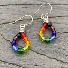 Rainbow dangle drop earrings, made with Czech fire polish glass beads, 4mm rounds, in a rainbow of colors on sterling silver wire.red - orange - yellow - olive green - emerald green - light blue - dark blue - amethyst purple - blackMeasure just under 1 1/2 inches in length, from top of sterling earwire to bottom of earring. Width is 1/2 inch at widest point. ~~~~~~~~~~~~~~~~~~~~~~~~~~~~~Artisan Crafted. All of my items, whether jewelry or decorative works, have been handcrafted by me, one person Rainbow Nickel-free Drop Earrings, Nickel-free Rainbow Drop Earrings, Colorful Hypoallergenic Dangle Jewelry, Rainbow Sterling Silver Nickel-free Earrings, Nickel-free Round Rainbow Beaded Earrings, Rainbow Teardrop Jewelry Set With Earrings, Rainbow Sterling Silver Jewelry With Ear Wire, Nickel-free Rainbow Sterling Silver Earrings, Nickel-free Rainbow Teardrop Earrings