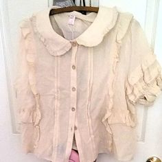 Light Weight And Breathable. Faux Wooden Buttons. Vintage Cream Color. Never Been Worn Or Washed. Fits Busts Size 40-50". Cream Blouse With Collar And Ruffles, Cute Collared Blouse With Ruffles, Beige Ruffled Collared Tops, Cream Short Sleeve Blouse With Ruffles, Handkerchief Hem Top, Poppy Color, White Ruffle Blouse, Pink Floral Blouse, Patch Work Blouse