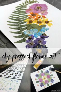 an art project with flowers painted on paper and paintbrushes sitting next to it