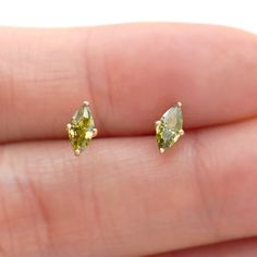 Simple everyday marquise cut stud earrings made in 10K yellow gold and natural peridot gemstone * Stone info: natural peridot marquise cut(due to natural stone, the color might vary), 0.28ct each, 0.56ct for the pair * Earring size: 7x3.5mm * Metal: 10K Yellow Gold * Sold as Single Stud or A Pair. * Each stud comes with a 10K gold silicone nut backing and 10k solid gold back will be provided at an additional cost * Stamp: 10K ❤️Visit our official website for exclusive new products.      https://elekalonjewelry.com/ ❤️Follow us on Instagram @ elekalonjewelry for the latest projects and much more! ❤️If you have any questions, please feel free to message us. Luxury Yellow Gold Peridot Earrings, Elegant Luxury Peridot Earrings, Luxury Elegant Peridot Earrings, Peridot Earrings Studs, Marquise Earrings, Peridot Jewelry, Peridot Earrings, Solitaire Earrings, Jewelry Minimalist