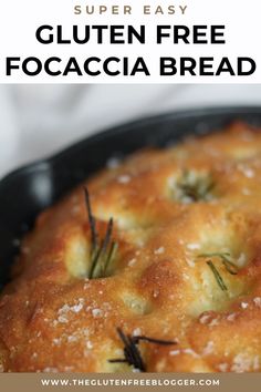 gluten free focaccia bread in a pan with rosemary sprigs