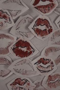 many different pictures of lips on paper with red and black lipstick imprinted on them