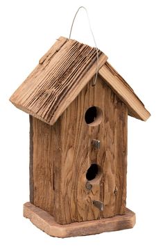 a wooden birdhouse with two holes in the roof