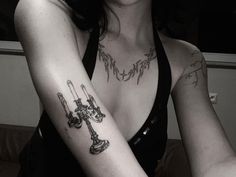 a woman with a tattoo on her arm