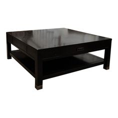 a black coffee table sitting on top of a white floor