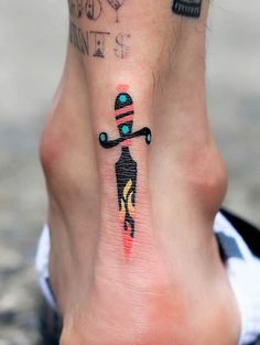 a person with a small tattoo on their foot