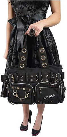 Our alternative black shoulder bag features studs, chains, handcuffs and more.A spacious shoulder bag with large twin front zipped pockets with more than enough space for anything you can need, and comes with metal handcuff and pyramid stud decoration. The webbing handles are matched by a webbing belt that shapes the bag and can be loosened. Handy side pockets for easy access and pen holders on the outside mean this bag packs a serious punch.- Large spacious shoulder bag- Monochrome stiped patte Grunge Bags With Zipper Closure For Concerts, Alternative Black Shoulder Bag With Zipper Closure, Alternative Black Shoulder Bag With Zipper, Black Alternative Shoulder Bag With Zipper Closure, Alternative Style Black Shoulder Bag With Zipper, Alternative Style Shoulder Bag With Zipper Closure, Alternative Style Shoulder Bag With Zipper, Punk Style Bag With Zipper Closure For Concerts, Black Punk Shoulder Bag With Zipper Closure