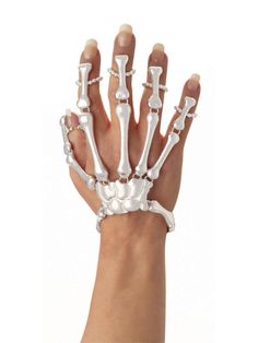 PRICES MAY VARY. Hand skeleton detail bracelet with wrist and finger straps Pearl white bone hand skeleton accessory with hinged finger bone design for comfortable movement Important: costumes are sized differently than apparel, use the Forum women's Standard adult size; and read reviews before purchase, do not choose based on age or clothing size Pair with Forum other bone collection costume accessories to create your desired look Forum Novelties has been providing quality costumes and accessor Skeleton Hand Bracelet, Halloween Skeleton Hand, Women Skeleton, Skeleton Halloween Costume, Bones Bracelet, Skeleton Costume, Skeleton Bones, Skeleton Skull, Skull Hand