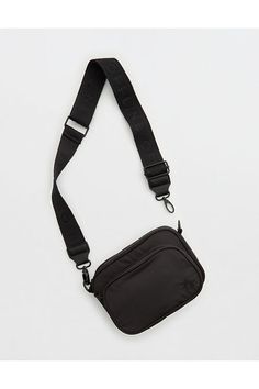 THE LOOK: Smooth, durable nylon./THE FEEL: Two compartments with zipper closure./THE MOVES: Your everyday, on-the-go routine./Accessibility deets: comfortable, adjustable strap designed with you in mind! Thick Strap Crossbody Bag, Offline By Aerie, Black Crossbody Bag, Crossbody Bags For Travel, Black Crossbody Purse, Festival Bag, Xmas Presents, Guitar Strap, Flight Attendant