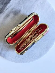 Elegant and classic wedding gift- The beautiful case has little mirror attached and come with 10 pieces of gold bobby pins. case measurement: 3cm x 10cm bobby pin measurements: 5.4 cm 10 pieces of 10K gold bobby pins in a box BOITE LAQUE gathers all the special , unique and one-of-a-kind vintage jewels in good condition however little marks of pre-owned may be shown. These little signs make every vintage piece the best story jewelry and worth to add in your collection. All BOITE LAQUE vintage je Luxury Vintage Pins As Gifts, Good Wedding Gifts, Random Things To Buy, Bobby Pin Storage, Gold Bobby Pins, Bobby Pin Holder, Story Jewelry, Hair Accessories Gold, Vintage Gift Ideas