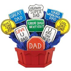 a bouquet of fathers day cookies in a red box with the words great dad on it