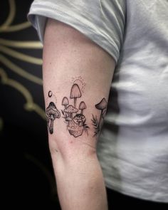 a woman with a mushroom tattoo on her arm