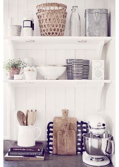 the kitchen counter is clean and ready to be used as a shelf for cooking utensils