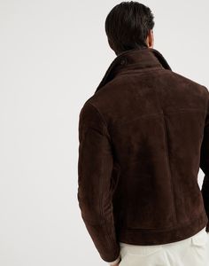 Suede shearling one-and-a-half breasted outerwear jacket The excellence of Brunello Cucinelli materials enhances the retro feel of this jacket with the iconic one-and-a-half-breasted closure. The suede shearling combines a smooth, velvety hand with a warm, plush interior, making it perfect to face the cold. The silhouette follows the classic codes of menswear with wide lapels on the collar. Luxury Brown Outerwear With Concealed Placket, Classic Shearling Outerwear With Pockets, Classic Shearling Long Sleeve Outerwear, Luxury Shearling Outerwear For Work, Fitted Shearling Outerwear With Padded Collar, Luxury Brown Pea Coat With Lapel Collar, Classic Sheepskin Outerwear With Long Sleeves, Classic Sheepskin Long Sleeve Outerwear, Classic Long Sleeve Sheepskin Outerwear