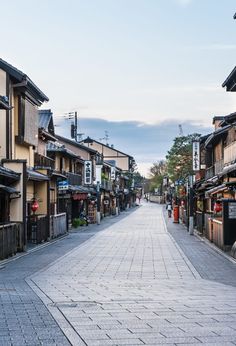 an empty street lined with wooden buildings