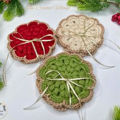 three crocheted coasters tied with twine