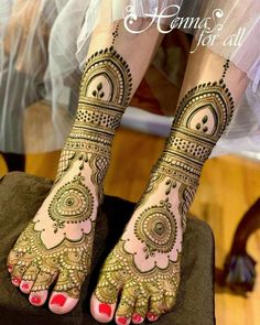 the feet are decorated with henna designs