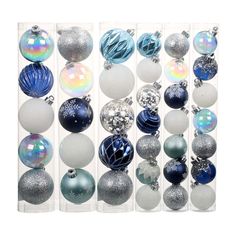 an assortment of christmas ornaments in clear boxes