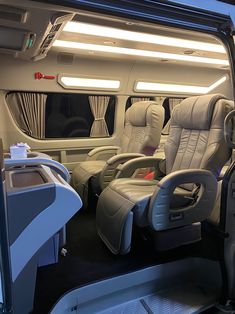 the interior of an airplane with leather seats