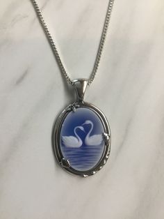 Swan Locket, Swan Accessories, Blue Gem Necklace, Cool Stuff To Buy, Blue Necklaces, Ocean Outfits, Two Swans, Swan Jewelry, Blue Jewellery